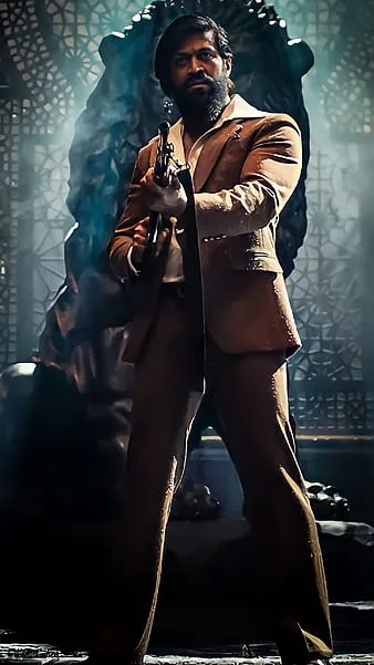 A high-quality, ultra-realistic cinematic photograph of a powerful South Asian man with a well-groomed full beard and short hair, standing