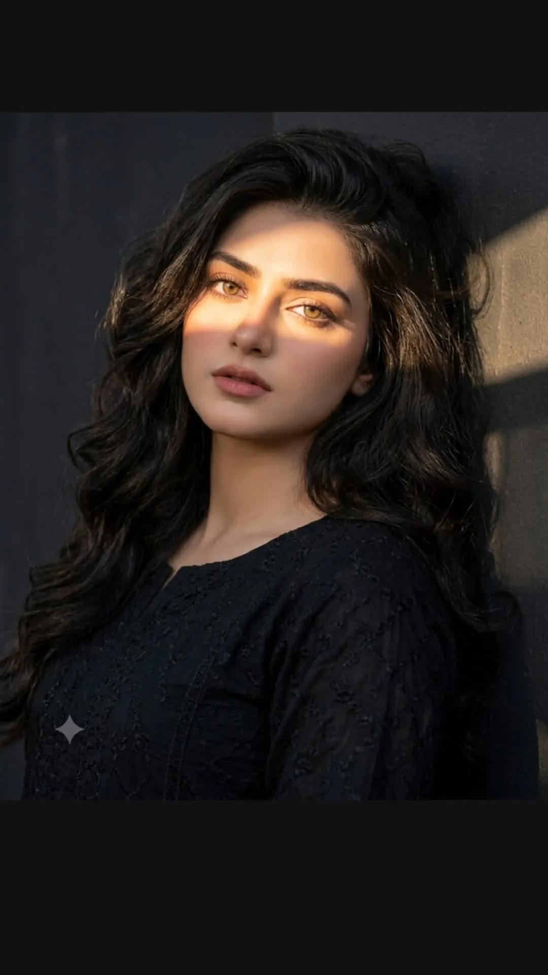 A cinematic portrait of a beautiful young South Asian woman with long, voluminous, wavy dark hair.