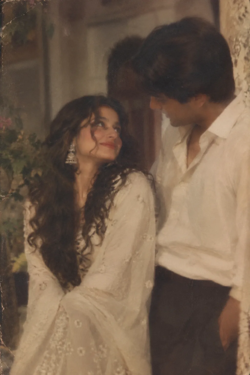 A highly realistic vintage Pakistani film-style portrait of a young adult South Asian couple from the old-fashioned era, captured as if
