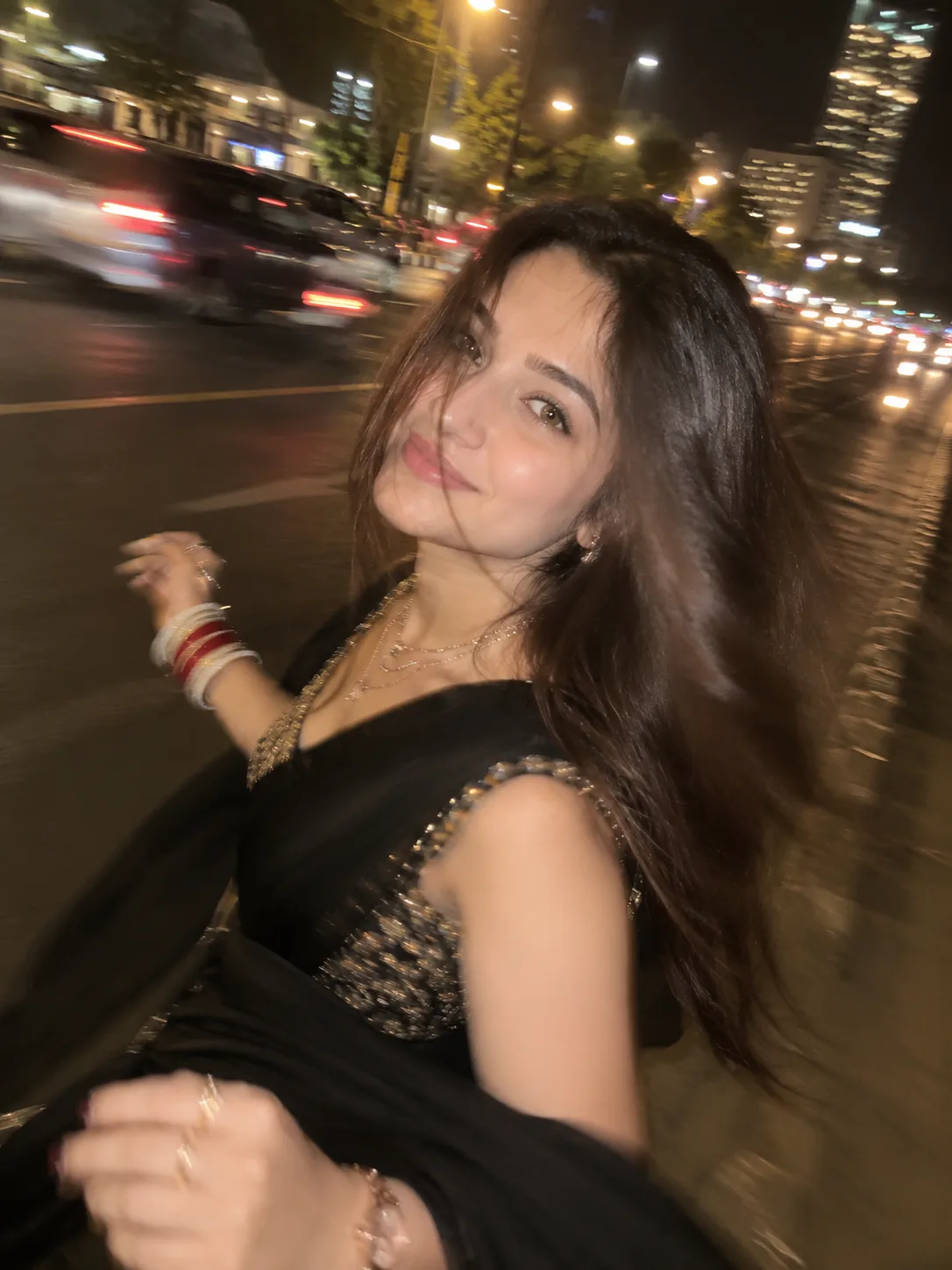 Convert the uploaded image into A young beautiful Woman Slightly side pose Turning round (gol ghum rahi hai) gol ghumte ghumte blur pic hua