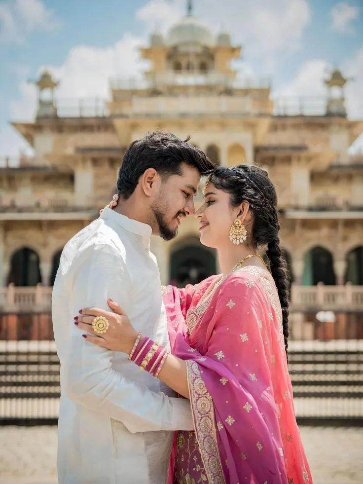A photorealistic vertical medium shot in 3:4 aspect ratio capturing the young South Asian couple from the reference image standing together