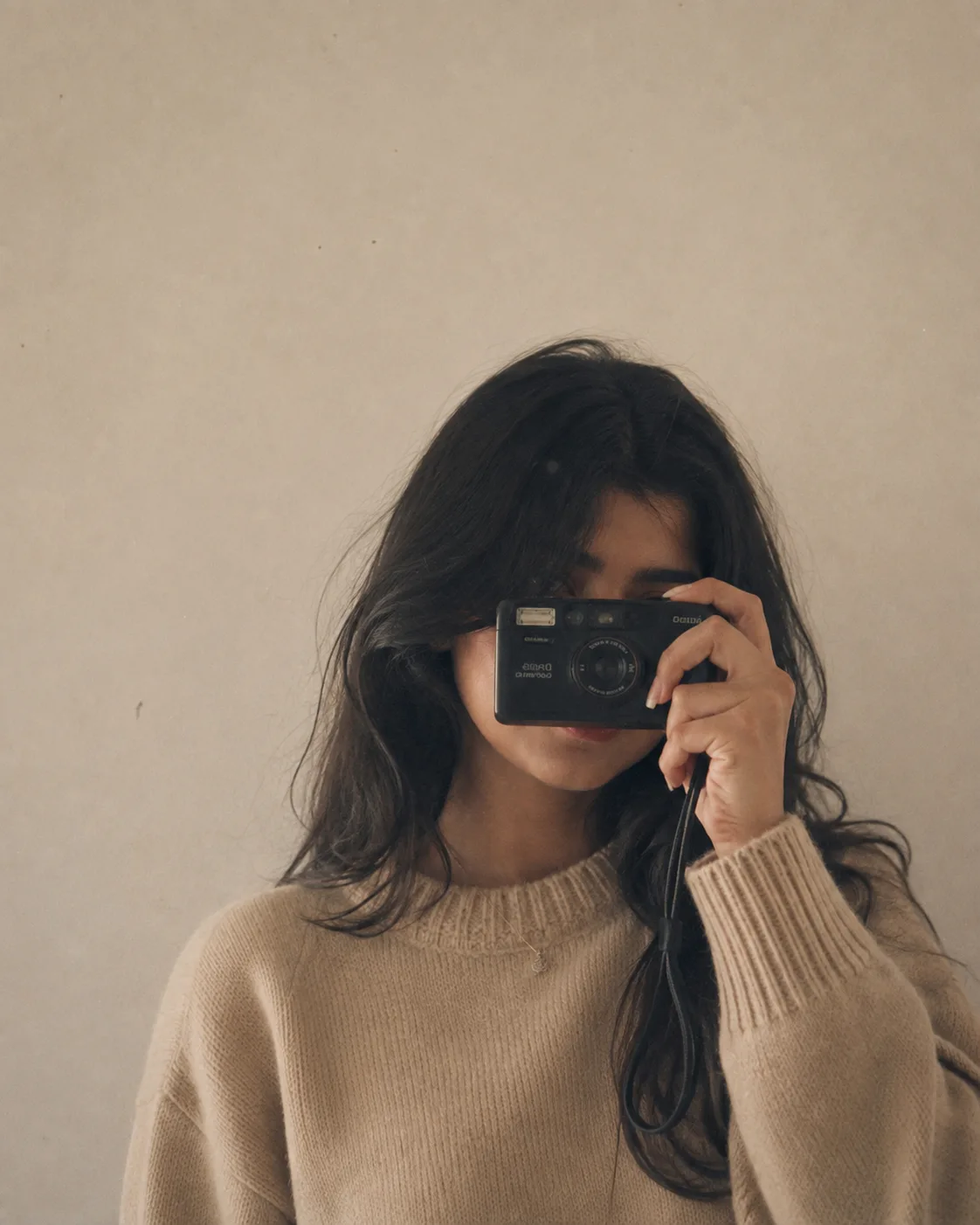 Create a minimal analog self-portrait in natural indoor light.