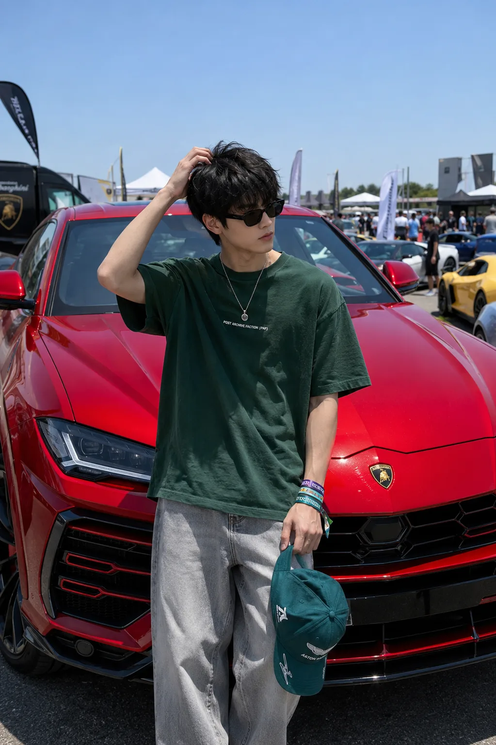 Create an **ultra-realistic, premium cinematic automotive lifestyle portrait of a stylish young male standing confidently in front of a