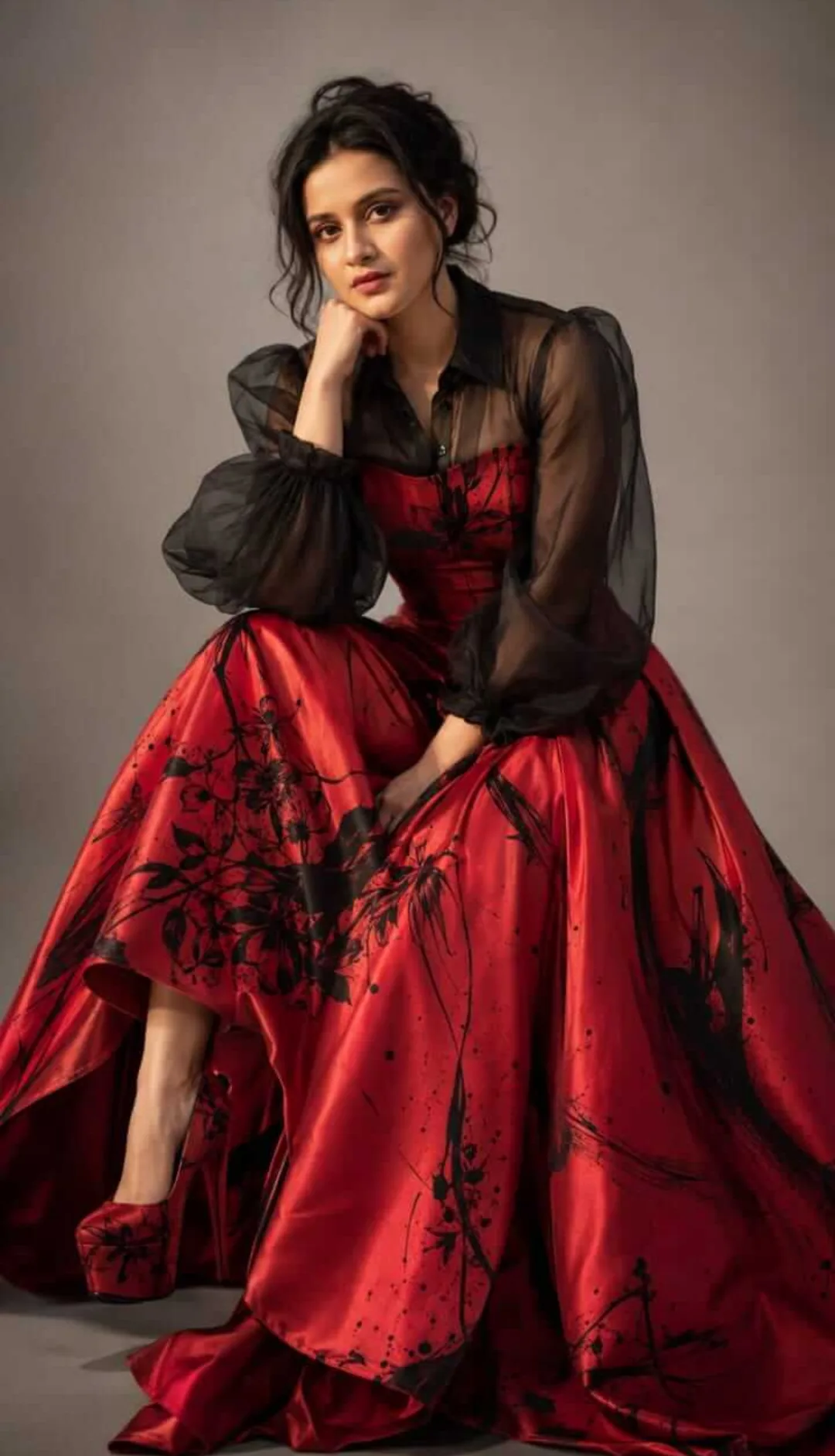 Ultra-realistic editorial high-fashion studio portrait of an elegant young woman seated gracefully, leaning slightly forward with her chin