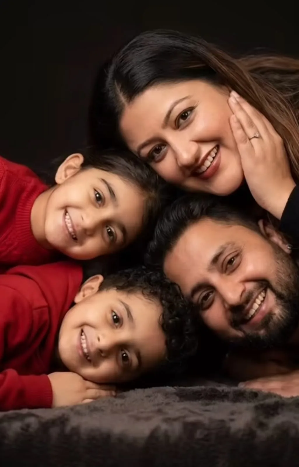 **Aspect ratio: 9:16 vertical, ultra-realistic intimate family portrait** A warm, emotional **close-up portrait of a loving South Asian