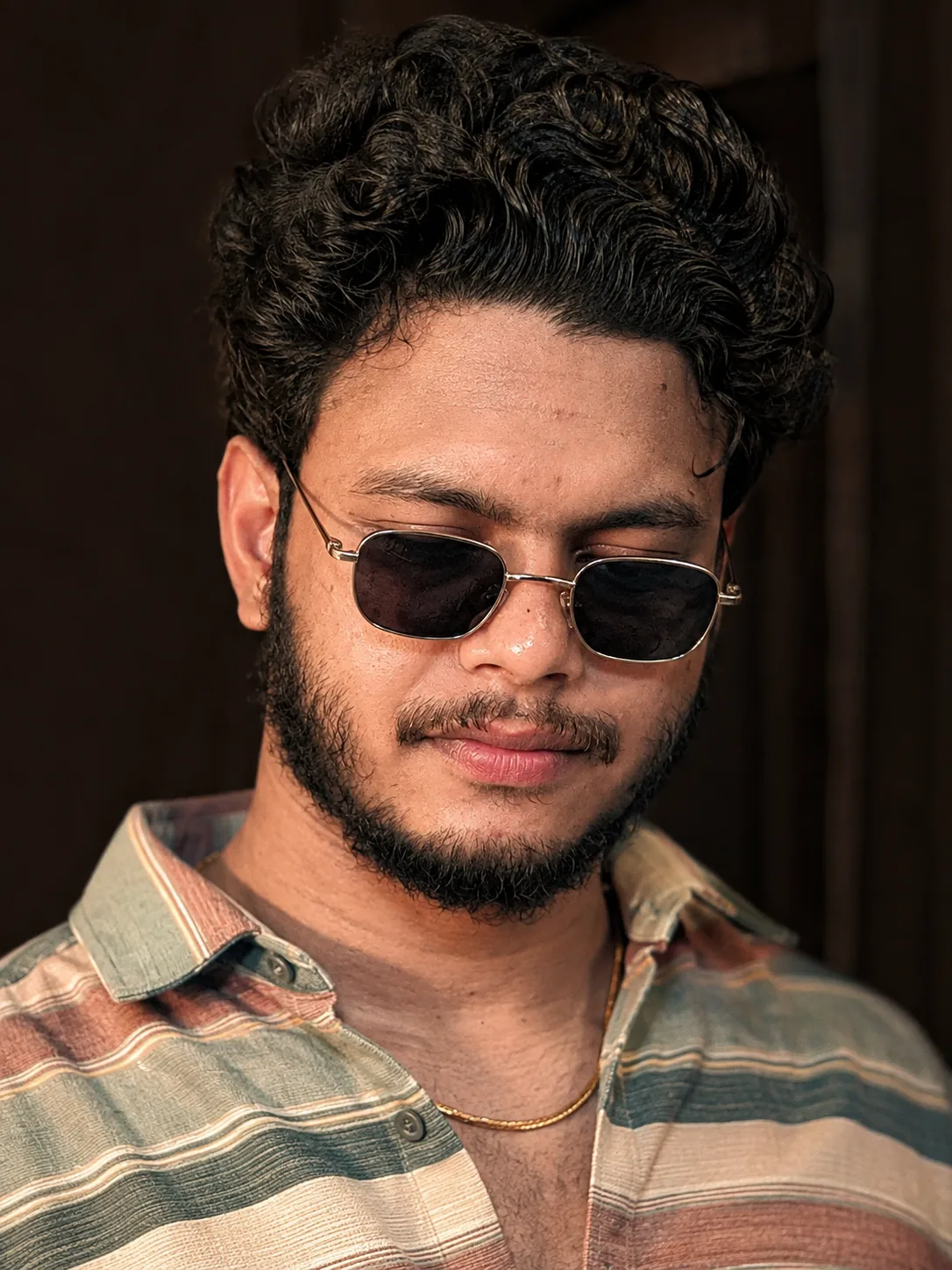 A hyper-realistic, cinematic portrait of the 26-year-old male subject from the reference image maintaining strict facial consistency, exact