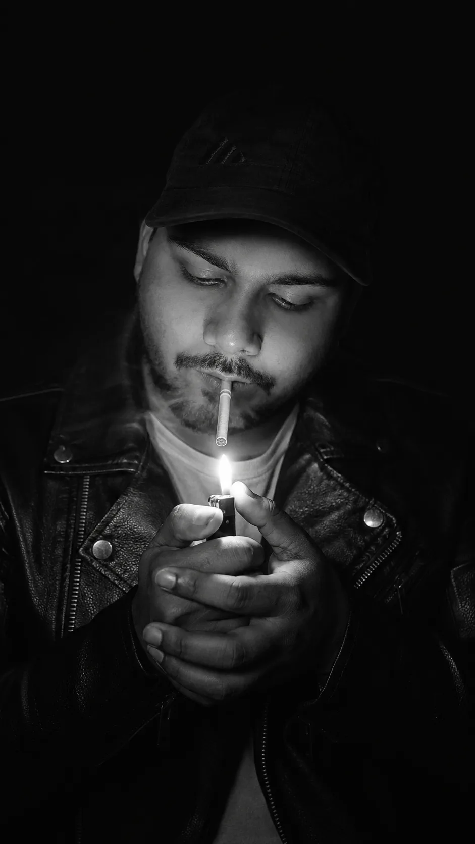 Create an ultra-realistic cinematic fine-art black-and-white portrait using my uploaded face photo as the PRIMARY IDENTITY REFERENCE and